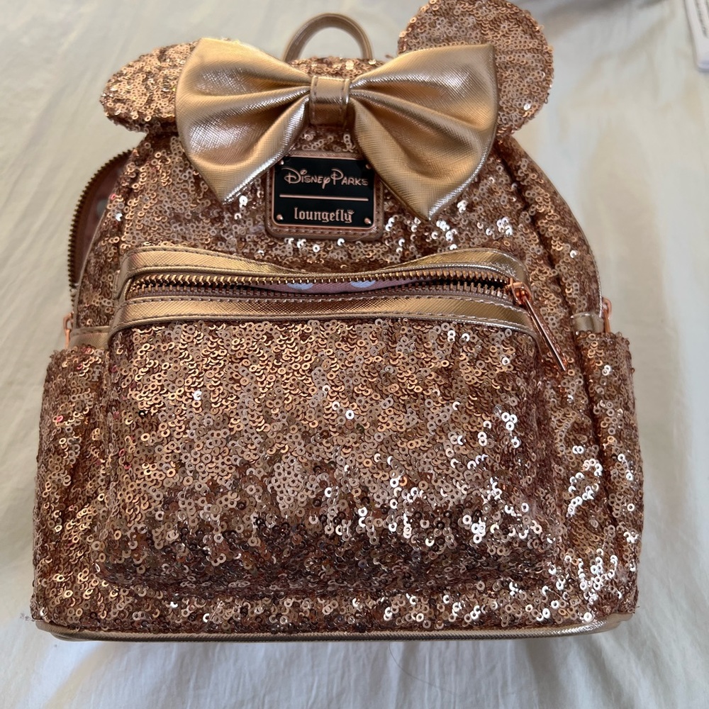 Disney park’s exclusive loungeflyrose Gold Minnie Mouse Sequin Backpack with Bow
